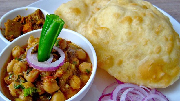 Chole Bhature with onion, chili, and achar (mixed spiced pickles)